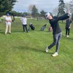 Contributed photo
Sam Herda tees off on the 3rd tee with Orcas players watching.