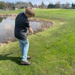 Contributed photo
Dylan Lawson chips onto the 9th green after laying up short of the water.