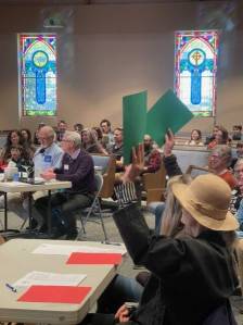 Contributed photo
Judges Carrie Unpingco and Carla Wright hold up green cards to signify a correct answer at last years Spelling Bee.
