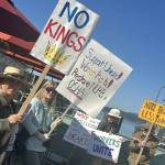 Contributed photo
Attendees hold up signs as the ferry docks.