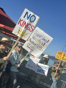 Contributed photo
Attendees hold up signs as the ferry docks.