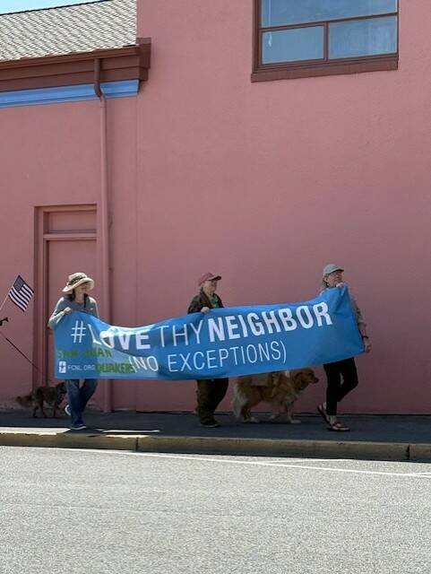 Heather Spaulding \ Staff photo
The Quakers carried a Love Thy Neighor banner.