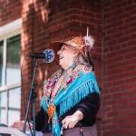 Rebecca French encourages the crowd to stand up for future generations.