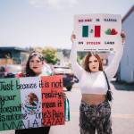 Protesters displaying their signs.