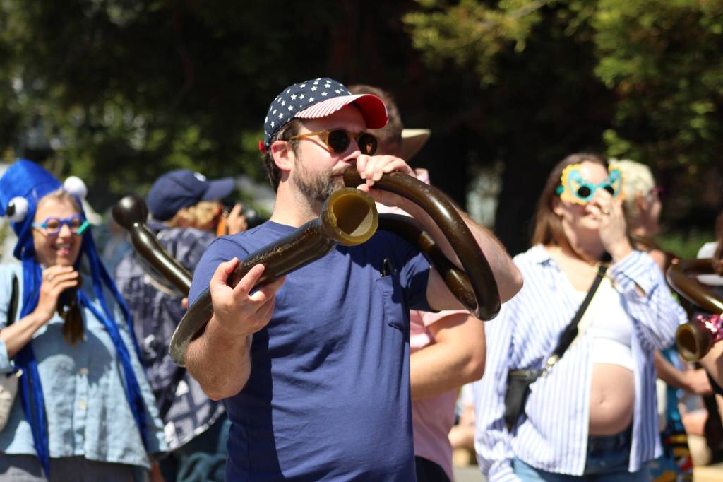 Heather Spaulding \ Staff photo
One of the UW labs marchers playing a bull kelp.