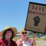 Heather Spaulding \ Staff photo
Islanders hold up their signs July 17.