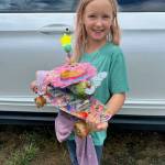 Staff photo \ Kristina Stucki
Georgia Stucki shows off her Zucchini 500 zucchini.