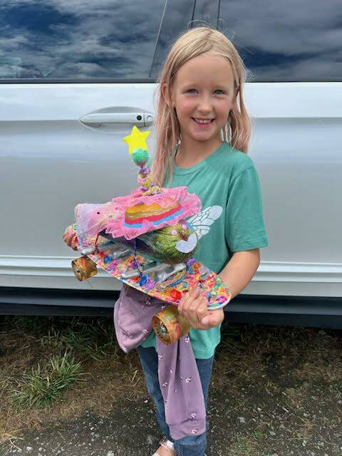Staff photo \ Kristina Stucki
Georgia Stucki shows off her Zucchini 500 zucchini.