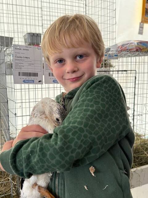 Staff photo Heather Spaulding
A duck and his boy, James Schulz.