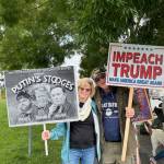 Staff photos / Heather Spaulding
Karen and Norris Palmer displaying their signs.