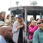 Contributed photo.
Tina Whitman, Friends of the San Juans senior science director (center), with local leaders and guests during the shoreline restoration boat tour, discussing strategies to protect and restore nearshore habitats.
