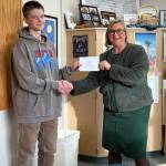 Contributed photo
Principal Andrea Hillman congratulates Grayson Matthews