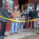Contributed photo by Norris Palmer
Mayor Ray Jackson cuts the ribbon while Jerry Alhadeff looks on.
