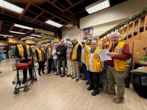 Contributed photo. 
Lions with Verne Howard, owner of Valmark, and Conrad and Margaret Berthold.