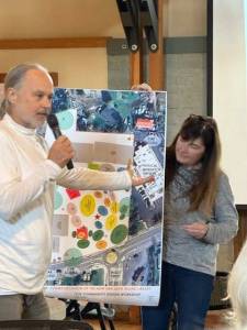 Heather Spaudling/staff photo.
Representatives from one table talk about the map they created.
