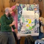 Heather Spaudling/staff photo.
Representatives from one table talk about the map they created.