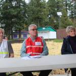 Heather Spaulding/staff photo.
Jessica Hudson, Mark Thompkins and Kari McVeigh listen as Brendan Andrews provides a briefing.