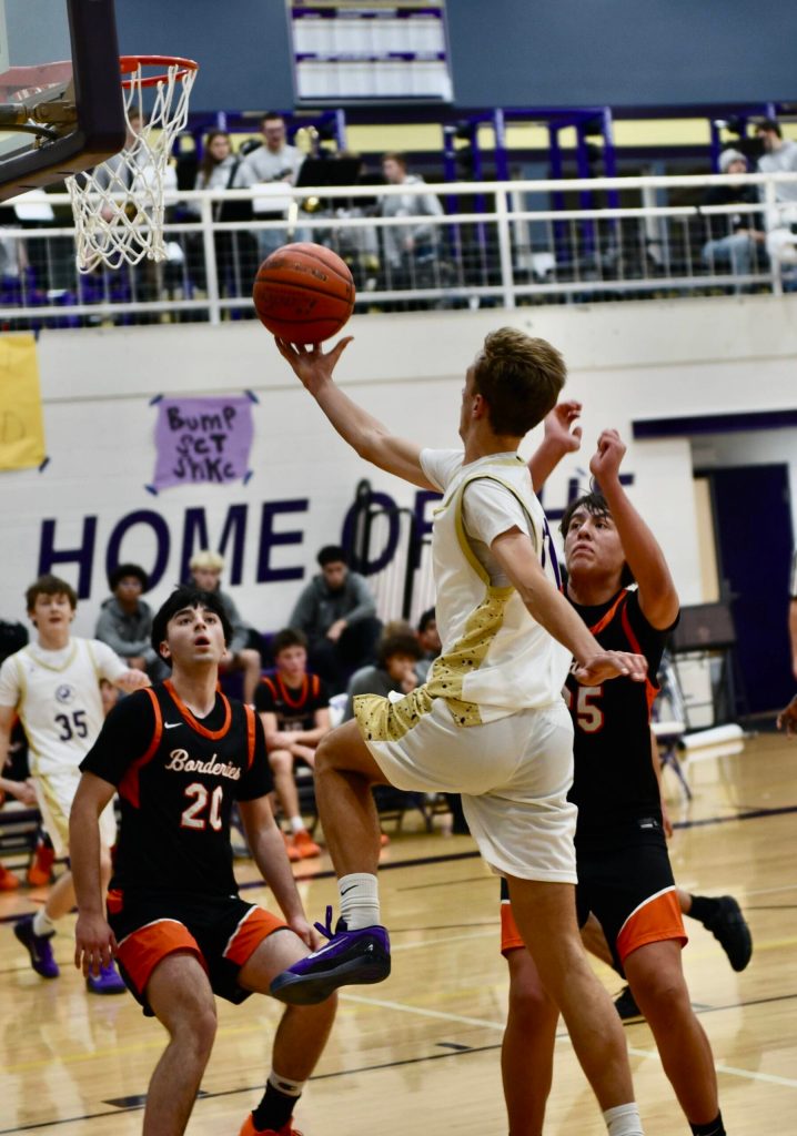 John Stimpson photo.
#11 Kaden Horn goes for a two-point layup.