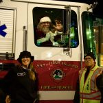 Santa on his way to light the Christmas tree.