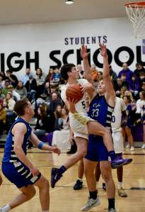 John Stimpson photo.
Channing Klein, #5, sails up to the basket.