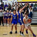 John Stimpson photo.
Duncan Bogart, # 1, drives the baseline toward the basket.