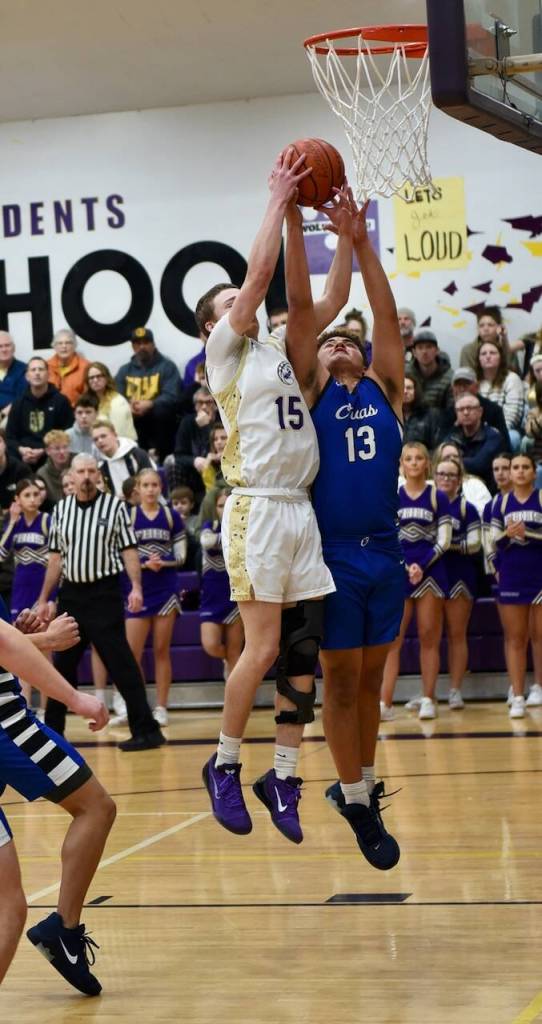 John Stimpson photo.
Ben Baisch, #15, takes control of a rebound.