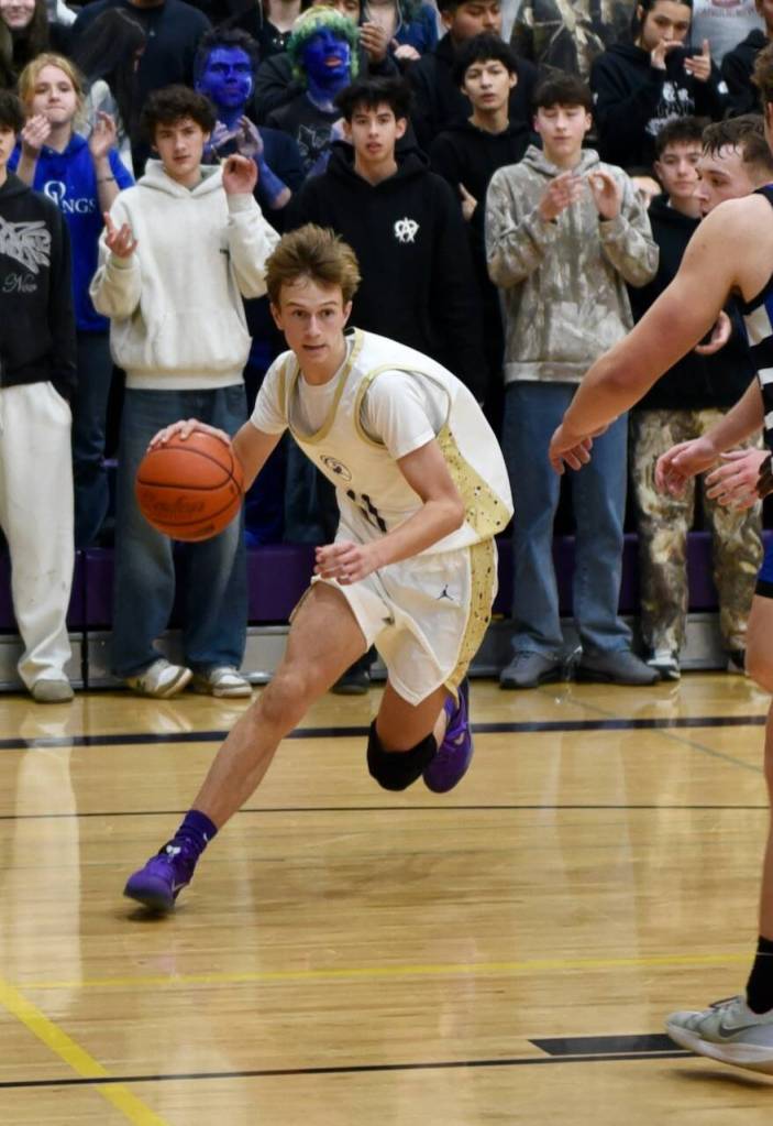 John Stimpson photo.
Kaden Horn, #11, drives to the basket for a two-point score.