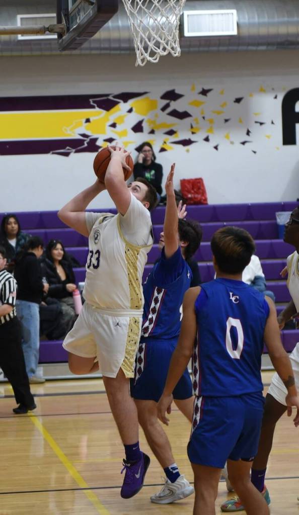 Contributed photo by John Stimpson
David Markham, #33, shoots for a two-point score.