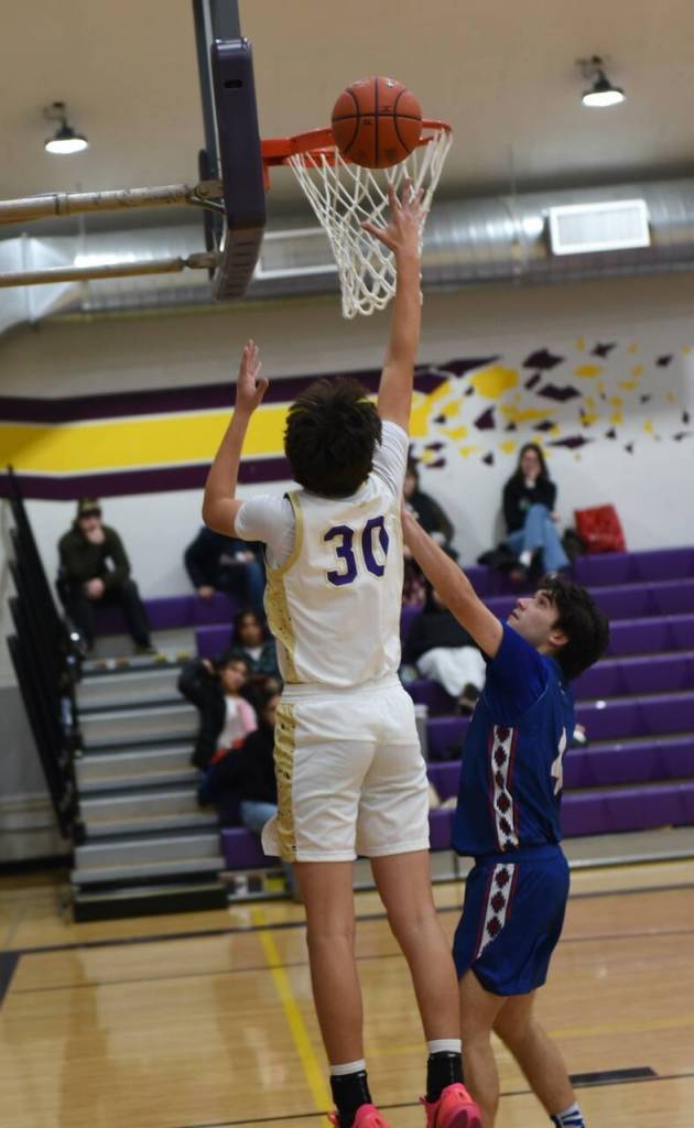 Contributed photo by John Stimpson
Hayes Penwell, #30, shoots for a two-point score.