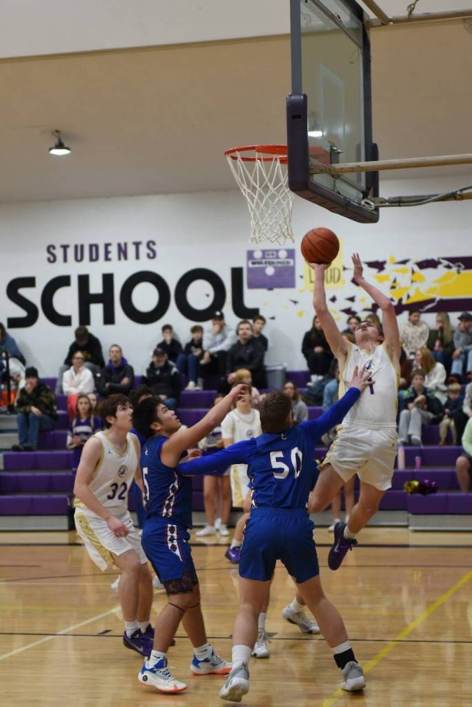 Contributed photo by John Stimpson 
Duncan Bogart, # 1, lays up a two point basket.
