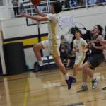Contributed photo by John Stimpson
Channing Kleine, #5, soars to the rim for two points.