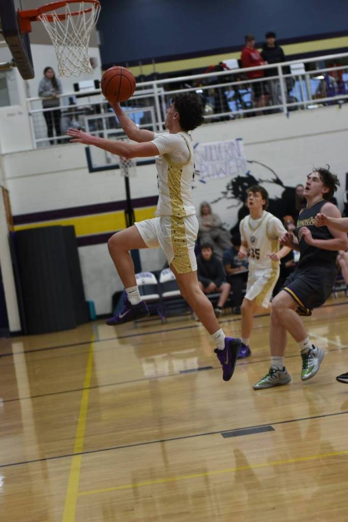 Contributed photo by John Stimpson
Channing Kleine, #5, soars to the rim for two points.