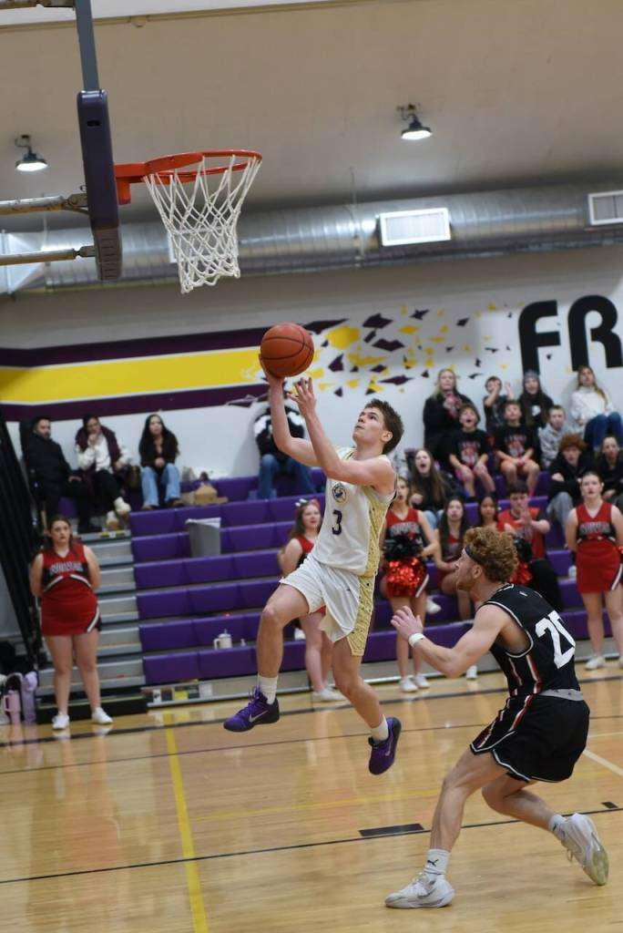 Contributed photo by John Stimpson
Phenix Thomas, #3, drives in for two points.