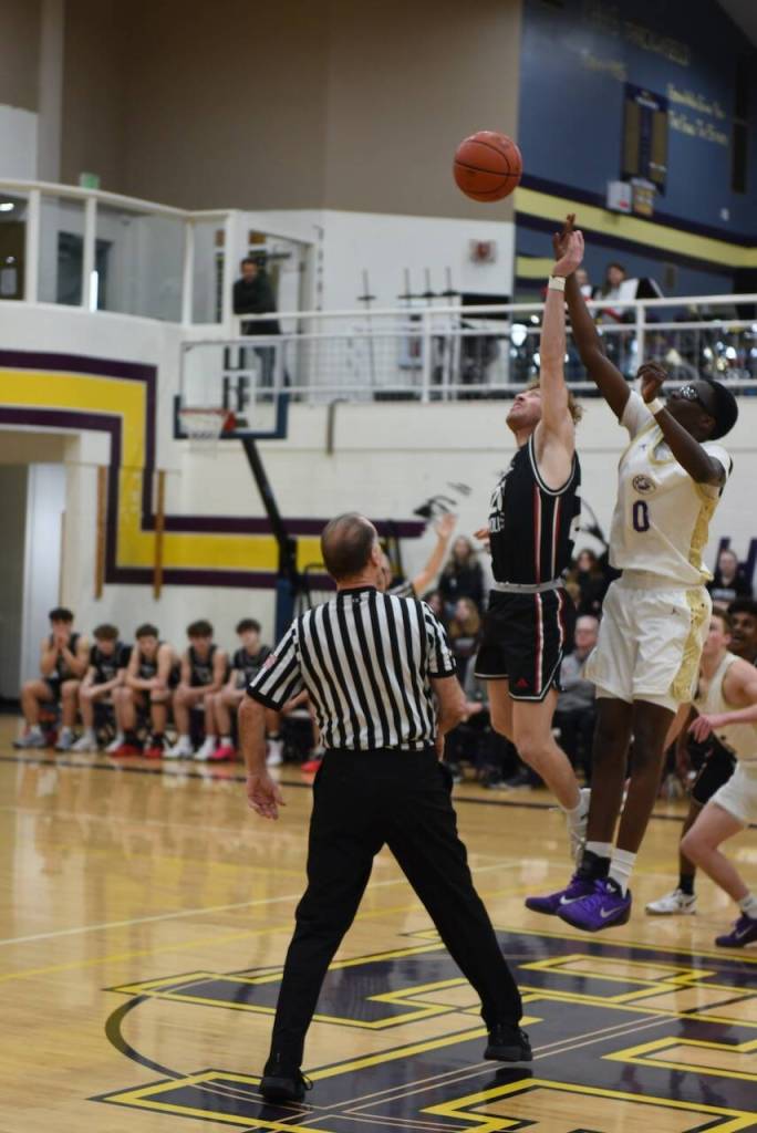 Contributed photo by John Stimpson
Mamadoo Hoskins, #0, controls the opening jump.