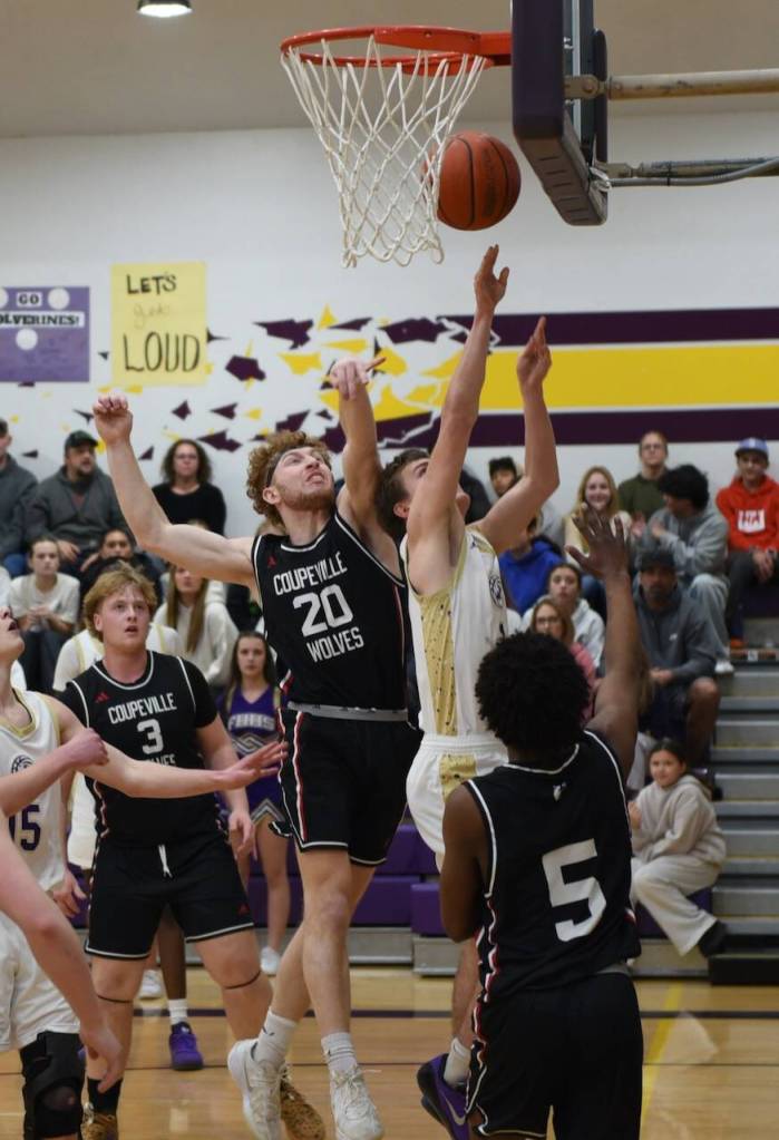 Contributed photo by John Stimpson
Duncan Bogart, #1, with strong defensive pressure scores two points underneath.