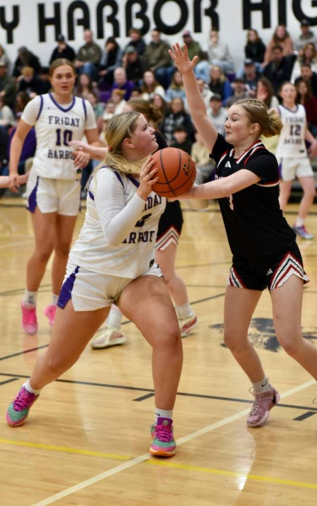 Contributed photo by John Stimpson
Lola Clark, #5, shoots underneath for two points.