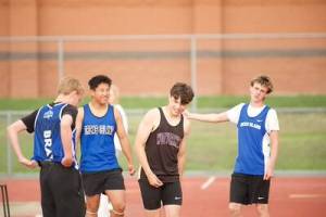 Darrell Kirk \ Staff photo
May 8, in Mount Vernon, athletes take a breath and show camaraderie to one another.