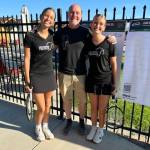 Coach Kevin Cullen, center, with Hazel Leighton, left, and Norah Leighton, right.