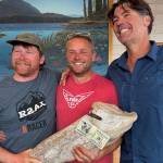 Contributed photo.
Gavin Brackett, Nige Oswald and Rob Woelfel with their prize money nailed to a piece of driftwood. Not pictured nutter: Mike Holt.